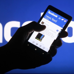 Smartphone user shows facebook application his phone zenica this file photo illustration